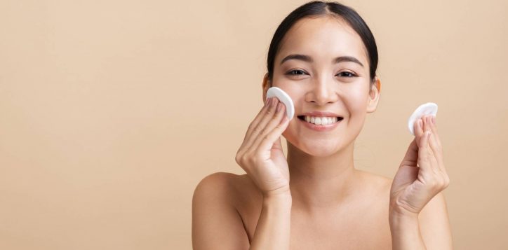 close-up-smiley-woman-with-cotton-pads-copy-space-1-2